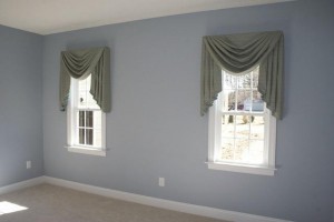 Master Bedroom - paint and window treatment fabric coordinate with the bedding and seating fabrics