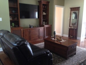 Family Room - again, there's stuff sitting about, but until everything has been unpacked what is presently on display may not remain where it is.  Don't know if you remember the reason for the cloth in the doors of the large cabinets.  The subwoofer is in the left cabinet so the right one had to match it.