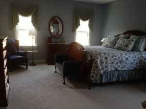 The Master Bedroom - I wish it were more evident how lovely the window treatments are in this room.  The colors so perfectly pick up the shades of blue in the bed quilt and pillows.  I love this room, it's so tranquil.  I hope my old stuff fits in well.  In choosing colors for the new house, I was very mindful of things to be used from the old house.  We needed to be frugal each step of the way.