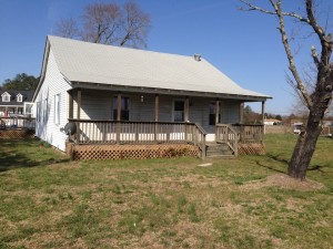 My childhood home missing its front shutters.